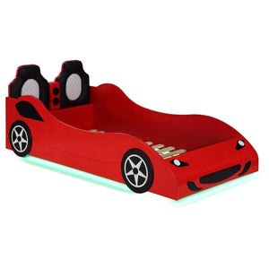 Modern race car aesthetics inform the design of a novelty car bed perfect for kids. Its twin size is versatile, allowing for plenty of space to play within the bedroom. The car is complete with realistic details and features LED strip lighting underneath,