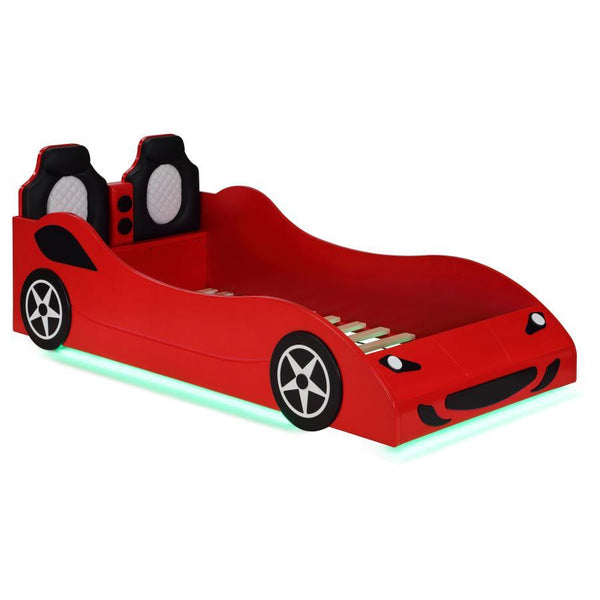 Modern race car aesthetics inform the design of a novelty car bed perfect for kids. Its twin size is versatile, allowing for plenty of space to play within the bedroom. The car is complete with realistic details and features LED strip lighting underneath,