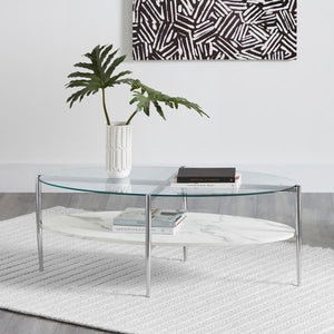  doubling as a cocktail table centerpiece. The clear tempered glass top offers durability and a modern touch