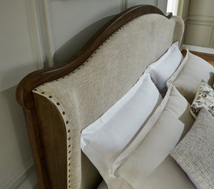 Sturlayne - Brown - California King Upholstered Panel Bed
