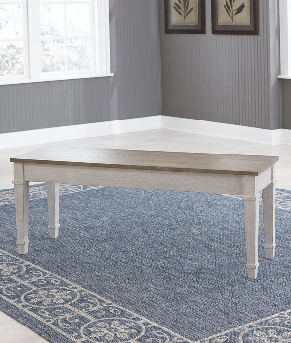  this piano style bench with under seat storage sports a grayish white finish with rub through effect for timeworn appeal.<br>