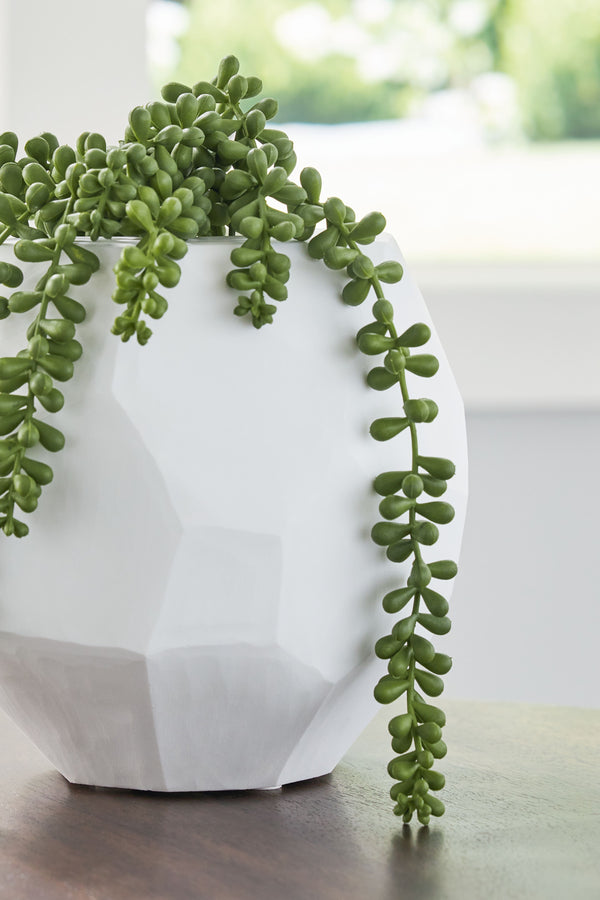  faceted look of the hand-carved surface and makes each piece one