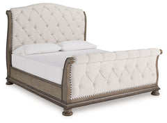 Merging traditional elegance with modern comfort, this king upholstered sleigh bed takes your bedroom retreat to the next level. It radiates timeless sophistication with its shapely curves, glazed antiqued-look finish and tufted cushions. Talk about stunn