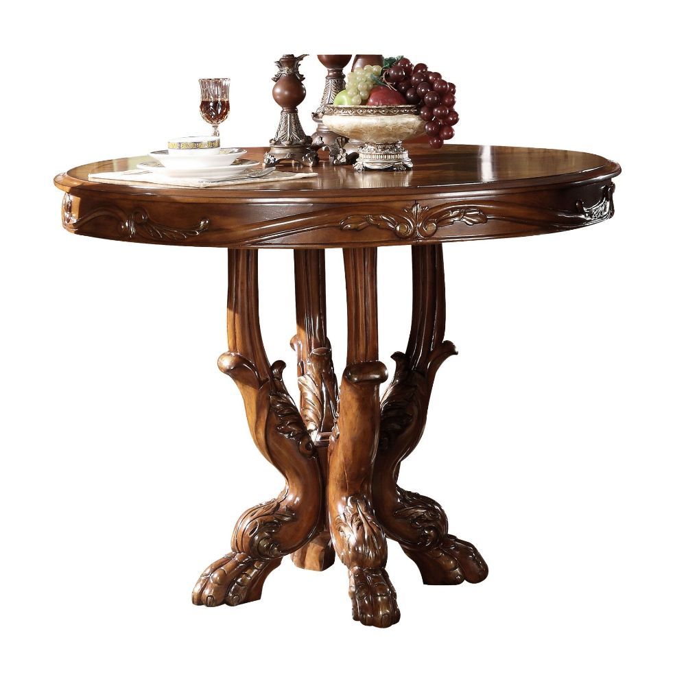 The Dresden traditional collection reflects highly decorative details, pedestal table, oversized claw feet and decorative carving inlay veneers on apron. The dining chairs reflect carefully selected wood carving and upholstery in a symphony of material. M