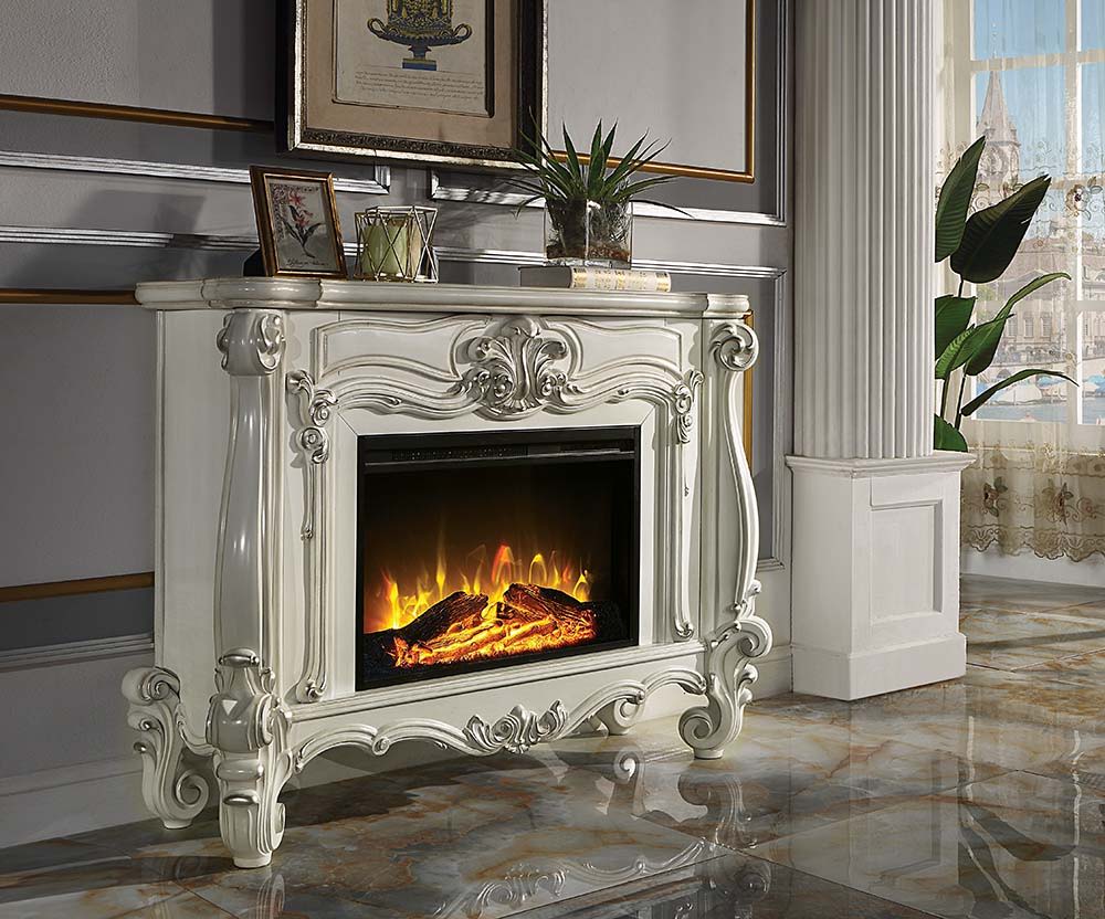 Gather the family around the Versailles fireplace in bone white. Traditional details such as scroll legs and carvings make this piece a masterpiece. It comes equipped with fire safety technology that continuously monitors the temperature of the plug and w