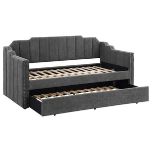 Welcome guests to stay for the night with this contemporary twin daybed and trundle set. Wrapped entirely in a charcoal gray velvet fabric with an Art Deco-inspired channel tufted design and stepped edges, this twin daybed is as stylish as it is comfortab