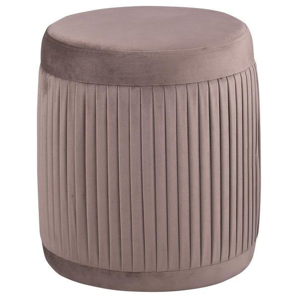 Add a hint of comfort and color to your living room with a modern drum ottoman. Its petite size is perfect for an accent chair, offering flexibility to serve as footrest or seat. It features mauve upholstery with a deep, muted tone that complements in a w