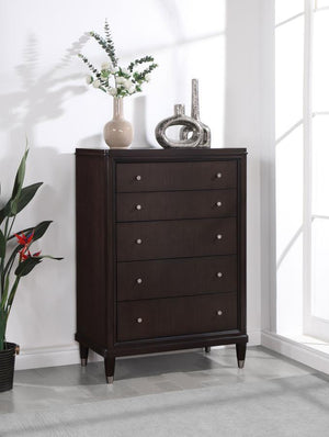  perfect for a stylish bedroom with sophisticated presence. Its five drawers offer abundant storage. The top drawer includes 