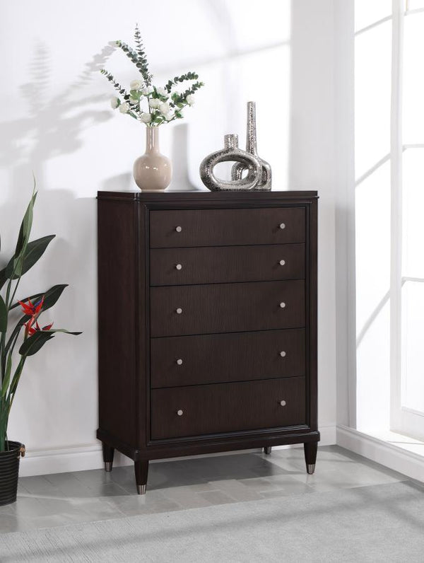  perfect for a stylish bedroom with sophisticated presence. Its five drawers offer abundant storage. The top drawer includes 