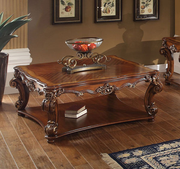 KD, Square Table w/Scrolled Leg and Bottom Shelf â€¢ Top Apron: Scrolled Decor Trim<br/><br/><b>Product Features</b><ul><li>Case: 1Pc/1Ctn</li><li>Finish: Cherry</li><li>Style: Vintage</li><li>Materials: Wood, Poly Resin, Veneer (Wood)</li></ul><br/>