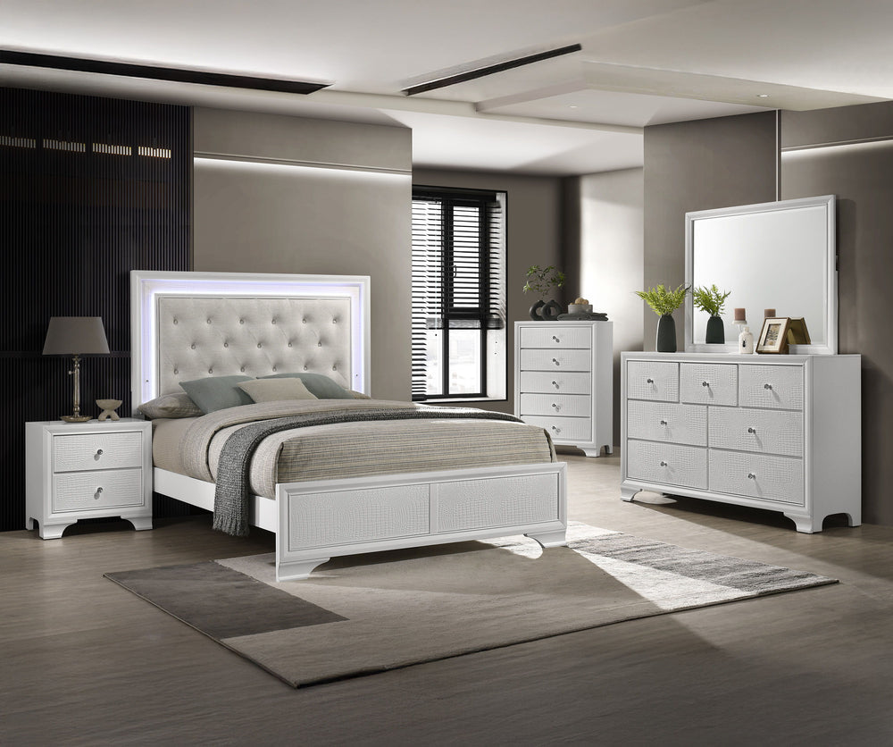 Step into a realm of sophistication and comfort with this stunning bedroom collection. Each piece showcases an exquisite blend of traditional charm and contemporary flair, making a bold statement with its textured surfaces and crisp white finish. The bed,