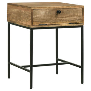 This end table pairs rustic charm with modern functionality. Crafted from solid mango wood in a honey brown finish, it offers a warm, inviting touch to any space. The drop-front door reveals a slim shelf for storing essentials, enhanced by chain accents f
