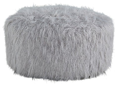 Don-'t shy away from decadence. Add a bit of bold design to your room with this oversized accent ottoman. The faux fur upholstery has a luxe look, and its casual light gray hue allows this plush piece to make a stylish statement in a variety of spaces.<br