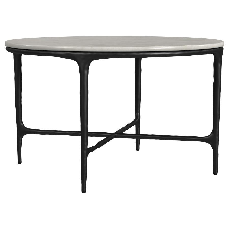 This coffee tableâ€™s genuine marble top rests on a sculptural metal frame, its subtly textured legs evoking artisanal craftsmanship. Present it as a center table, enhancing a refined lounge area. The marble surface makes an ideal backdrop for dÃ©cor, whi