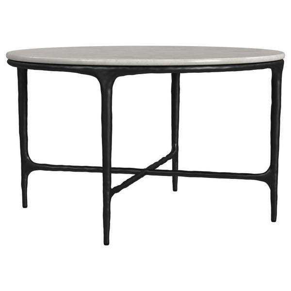 This coffee tableâ€™s genuine marble top rests on a sculptural metal frame, its subtly textured legs evoking artisanal craftsmanship. Present it as a center table, enhancing a refined lounge area. The marble surface makes an ideal backdrop for dÃ©cor, whi