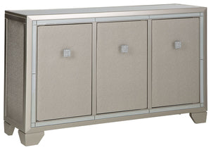 Reflect your love for contemporary style with this accent cabinet. It features a mirrored top and beveled mirror accents, adding both light and a touch of glam to your space. Decorated with faux crystal and chrome-tone pulls, the textured silvertone door 