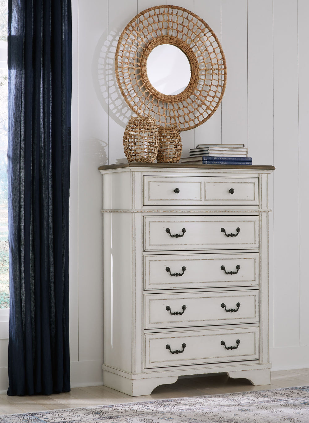 Traditional design. Casual appeal. You can have it all with this chest of drawers. A relaxed two-tone aesthetic merges with ornate profiled drawer fronts and pilasters to give the distinctive piece an allure all its own. Expansive drawers with quality dov