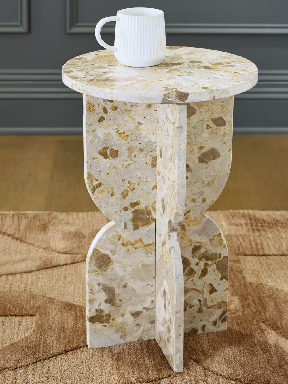 Looking for a unique piece that-'s a real conversation starter? This accent table combines the stunning beauty of natural stone with a head-turning sculptural base for an ultra-contemporary look. Whether it-'s in your entryway or main living space, this p