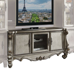 The Versailles the TV Stand was inspired by old European design. This collection features carved scrollwork accent on legs and trim base. Carefully crafted with selected wood and veneers in antique platinum finish with hand brush accents. Offers plenty of