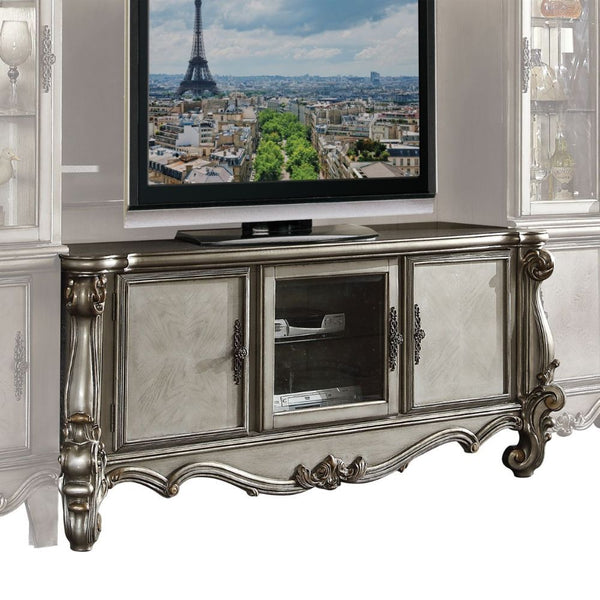 The Versailles the TV Stand was inspired by old European design. This collection features carved scrollwork accent on legs and trim base. Carefully crafted with selected wood and veneers in antique platinum finish with hand brush accents. Offers plenty of