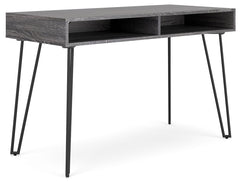 Sporting a sleek and simple profile, this home office desk is casual contemporary at its finest. The desktop is wrapped in a replicated dark charcoal gray wood grain and paired with decidedly mid-century style black legs for a familiar-yet-fresh design. A