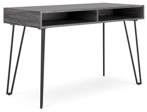 Sporting a sleek and simple profile, this home office desk is casual contemporary at its finest. The desktop is wrapped in a replicated dark charcoal gray wood grain and paired with decidedly mid-century style black legs for a familiar-yet-fresh design. A