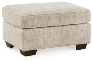 This ottoman speaks to those drawn to fresh, contemporary style with richly neutral appeal. Its firmly cushioned top offers room for comfort. Subtle and sophisticated, the plush upholstery and dark tri-block legs are a natural complement for so many color