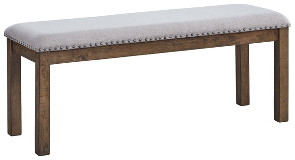 This upholstered dining bench elevates the art of casual rustic style. With a distressed nutmeg finish, antiqued nailhead trim and textured polyester fabric, this upholstered dining bench entices with warmth and earthy elegance. Cushioned seat accommodate