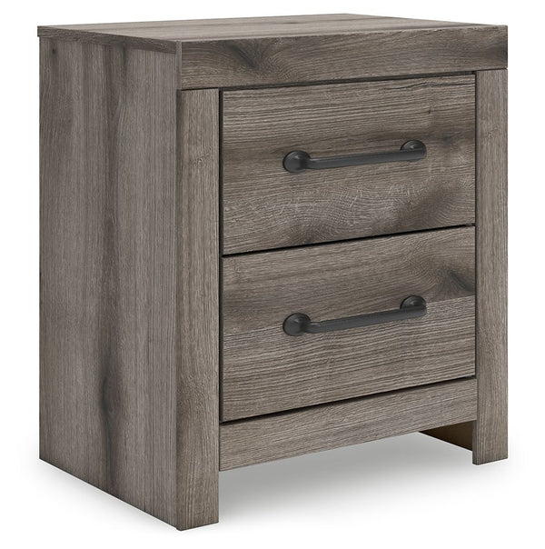 Combining a casual aesthetic with functional flair, this nightstand suits styles from rustic to industrial. Its smooth-gliding drawers store essentials with ease. Ready to recharge? Included USB ports allow you to keep go-to devices close. Dressed in a ch