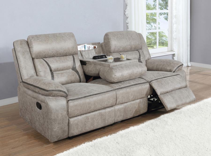 A motion sofa with a drop down center will serve you well in your entertainment space. Leatherette upholstery is enhanced with stitching details that make an impact in the craftsmanship. Pocket coil cushioning keeps you comfortable and cozy for hours of e