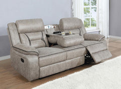 A motion sofa with a drop down center will serve you well in your entertainment space. Leatherette upholstery is enhanced with stitching details that make an impact in the craftsmanship. Pocket coil cushioning keeps you comfortable and cozy for hours of e