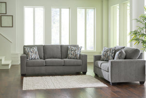 Youâ€™re in for a neat treat with this living room set. Its comfy seats are covered in soft, textural upholstery, and the wide track arms are eager to support your quest for total relaxation. Distressed abstract toss pillows bring a fresh breath of contem