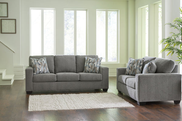 Youâ€™re in for a neat treat with this living room set. Its comfy seats are covered in soft, textural upholstery, and the wide track arms are eager to support your quest for total relaxation. Distressed abstract toss pillows bring a fresh breath of contem