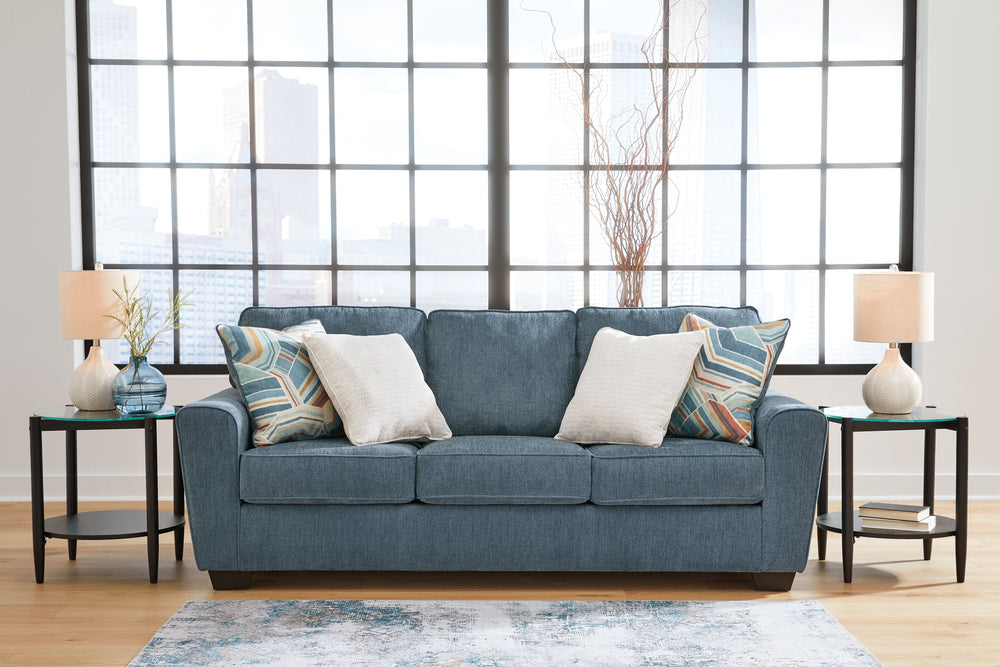 Need a simple style refresh? Liven up your living room essentials with this sofa. A chunky silhouette holds invitingly ample cushioning youâ€™ll long to lounge in. Crosshatched upholstery and accent pillows give the otherwise casual design a delightful vi