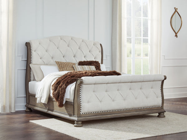 this king upholstered sleigh bed takes your bedroom retreat to the next level. It radiates timeless sophistication with its shapely curves