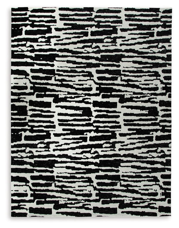 Revitalize your decor with this captivating rug. Infusing your surroundings with style, its abstract motif and rich neutral colors create the perfect pop of interest.<br/><br/><b>Product Features</b><ul><li>Made of polyester</li><li>Machine woven</li><li>