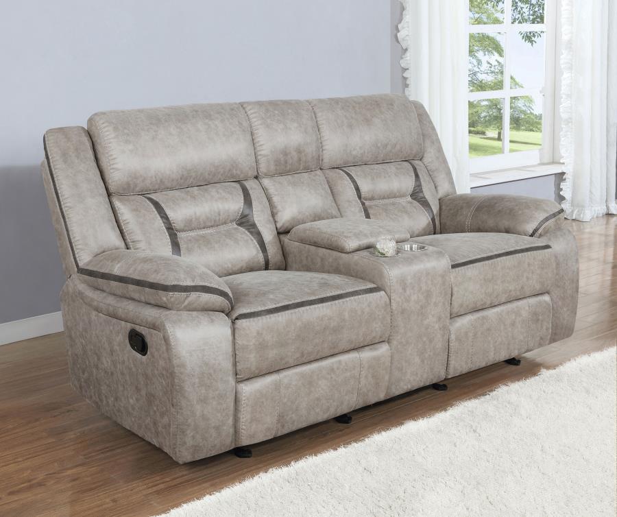 Every entertainment area deserves this glider loveseat with console. The neutral color palette makes it easy to blend with your decor. Its leatherette upholstery ensures a comfortable seating experience. A center console offers a small storage area for re