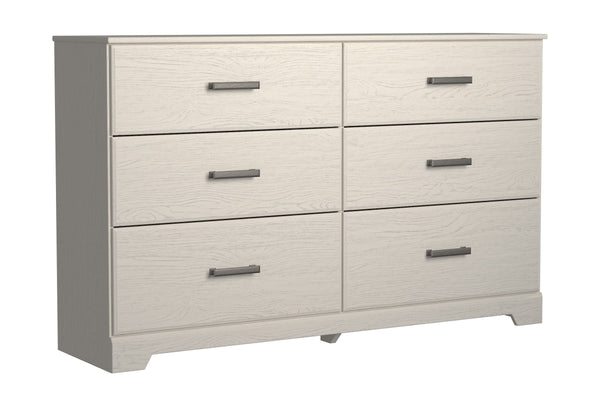With its clean-lined look and modern attitude, this dresser is a fresh style awakening. A crisp, white hue over subtle replicated wood grain easily complements other furniture finishes. Smooth drawer fronts with antiqued pewter-tone handles complete the a