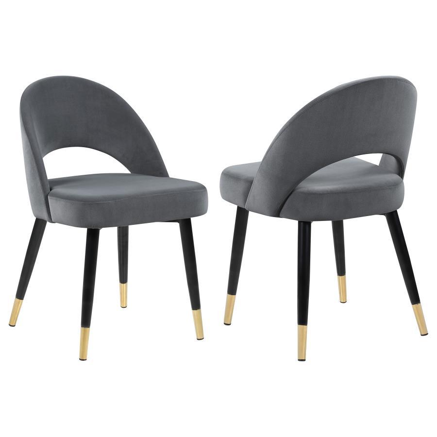 Add a touch of retro-inspired elegance to your dining room with this stylish dining side chair, featuring an elegant bucket-style seat that embodies Mid-Century modern charm. Wrapped in luxurious velvet, each chair provides a supportive, long-lasting seat