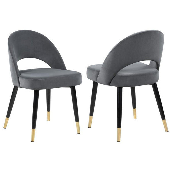 Add a touch of retro-inspired elegance to your dining room with this stylish dining side chair, featuring an elegant bucket-style seat that embodies Mid-Century modern charm. Wrapped in luxurious velvet, each chair provides a supportive, long-lasting seat