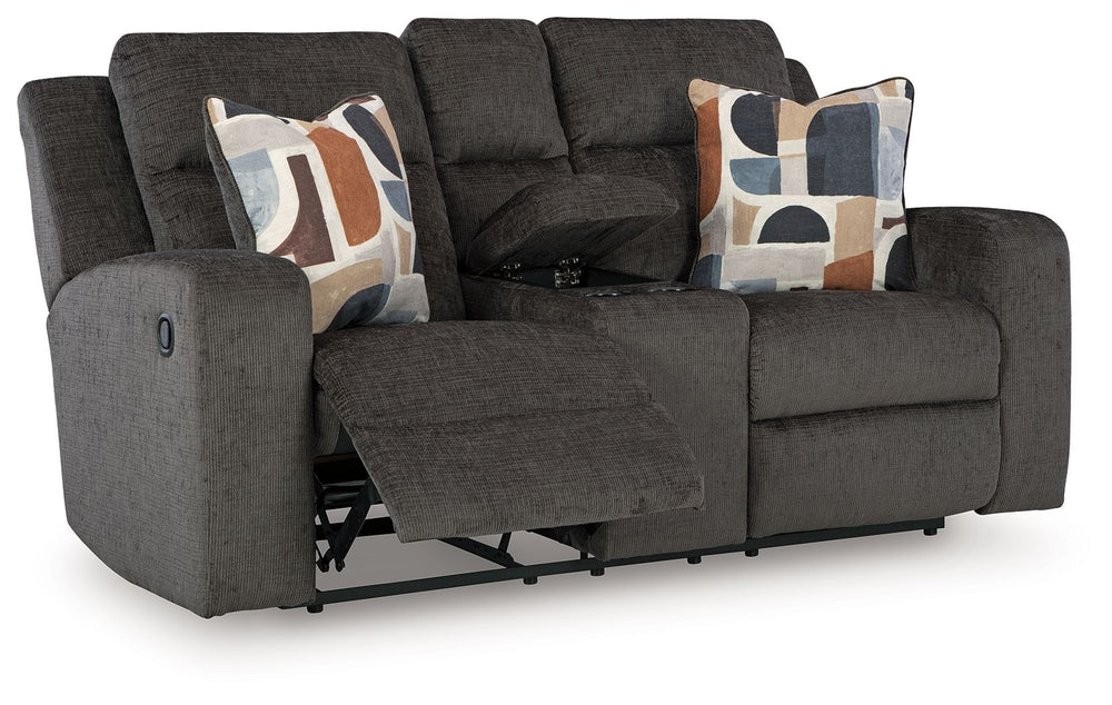 Indulgent comfort meets fashion-forward flair in this reclining loveseat with console. Its luxuriously soft upholstery and captivating color show off your cozy yet smart style. Sleek track arms infuse a modern sensibility, while the striking accent pillow