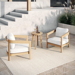  featuring two club chairs with plush white cushions and a matching end table