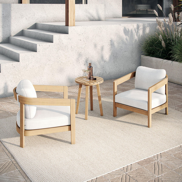  featuring two club chairs with plush white cushions and a matching end table