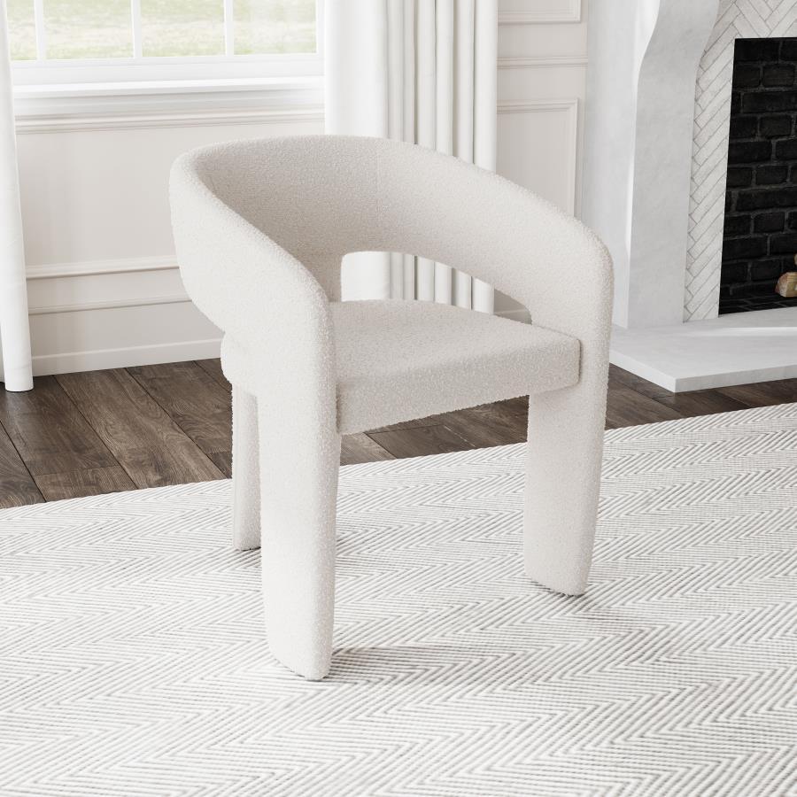 Refresh the look and feel of a modern dining room with a contemporary armchair. Stylish presence is created with its rounded silhouette, pairing a keyhole design with sloping arms for airy ambiance. Three wide legs provide excellent support, while foam cu