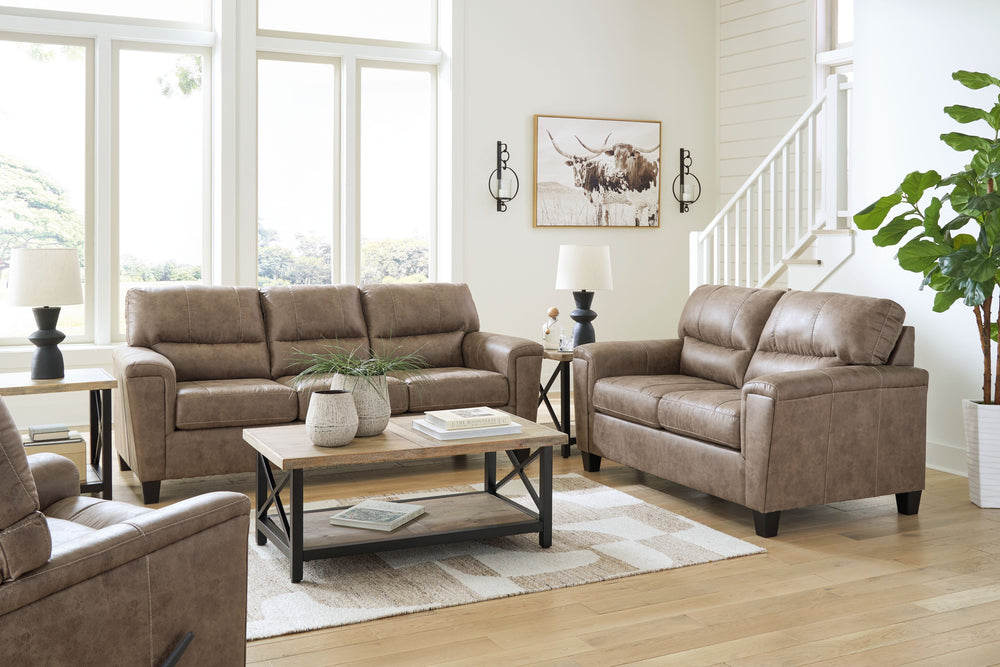 This decidedly modern living room set proves less is more, bringing simply inviting style to your living room. Take the guesswork out of decoratingâ€”its warm faux leather has a universal appeal, pairing with casual and contemporary aesthetics alike. All 
