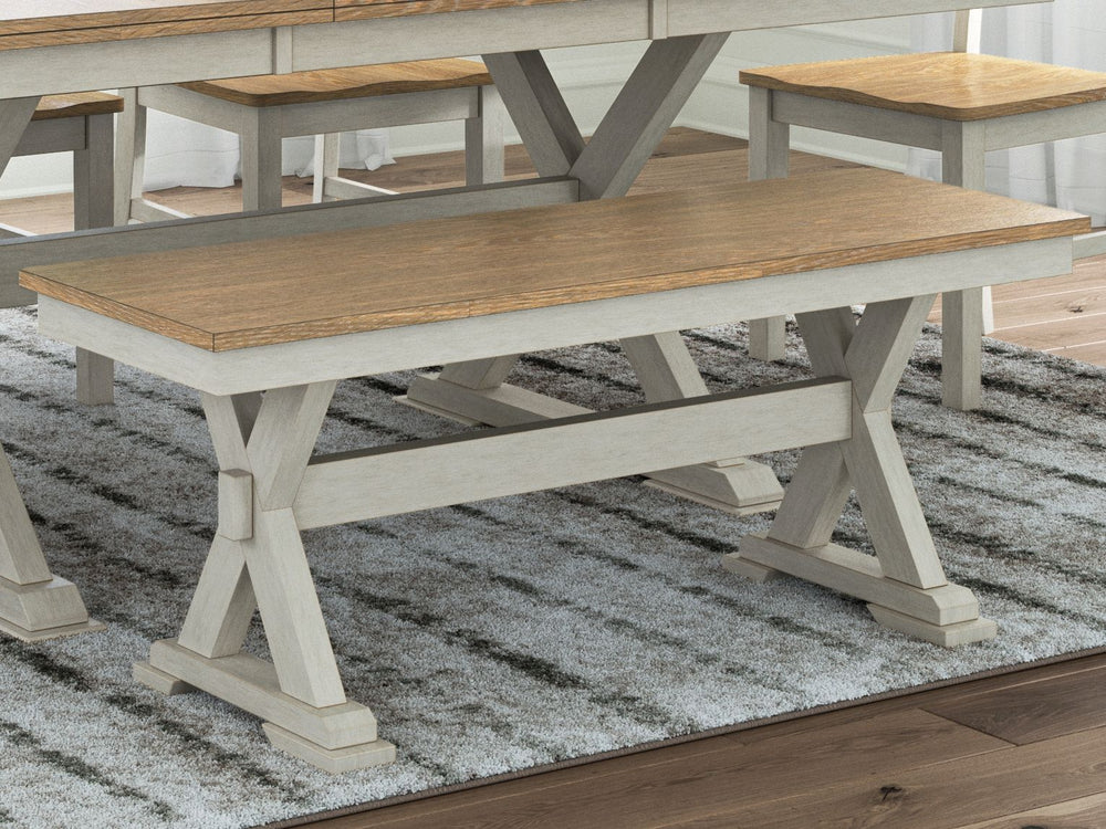 Busy breakfasts and family dinners get a dose of modern farmhouse flair with this dining bench. Its two-tone finish contrasts a light butcher block hue with antiqued white for an utterly charming effect. An effortless seating solution, the bench can tuck 