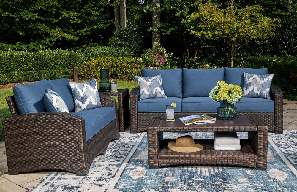 Brown resin wicker woven on an aluminum frame. High performance Nuvella fabric. Stainless steel hardware. Two throw pillows included with loveseat and sofa. <h4><b>Windglow - Blue/Brown - Sofa with Cushion</b></h4> <table width=-"100%-"><colgroup><col sty