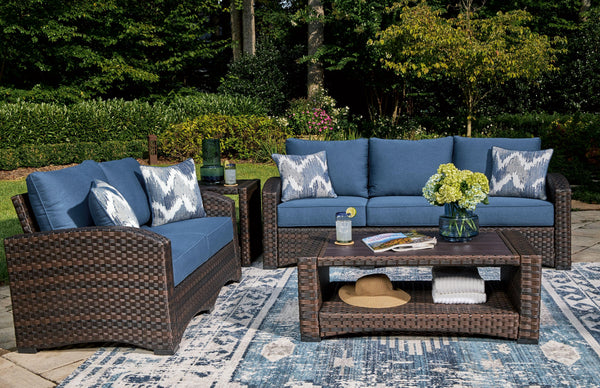 Brown resin wicker woven on an aluminum frame. High performance Nuvella fabric. Stainless steel hardware. Two throw pillows included with loveseat and sofa. <h4><b>Windglow - Blue/Brown - Sofa with Cushion</b></h4> <table width=-"100%-"><colgroup><col sty