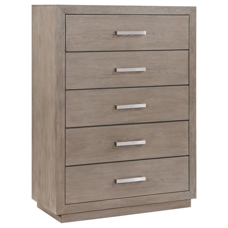 Chrome finish bar pulls add a touch of shine to the neutral barley brown finish of a modern five-drawer chest. Delivering ample storage with a compact footprint, the chest features a streamlined silhouette with mitered trim that creates a sense of depth. 