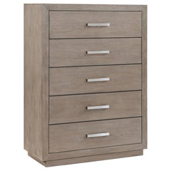 Chrome finish bar pulls add a touch of shine to the neutral barley brown finish of a modern five-drawer chest. Delivering ample storage with a compact footprint, the chest features a streamlined silhouette with mitered trim that creates a sense of depth. 